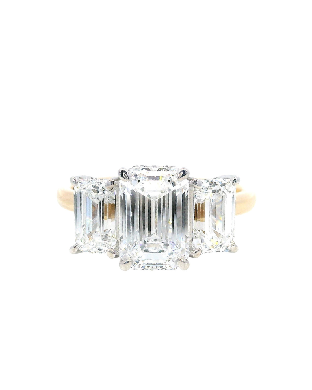 Emerald Cut Diamonds in the Trilogy Design with Hidden Halo