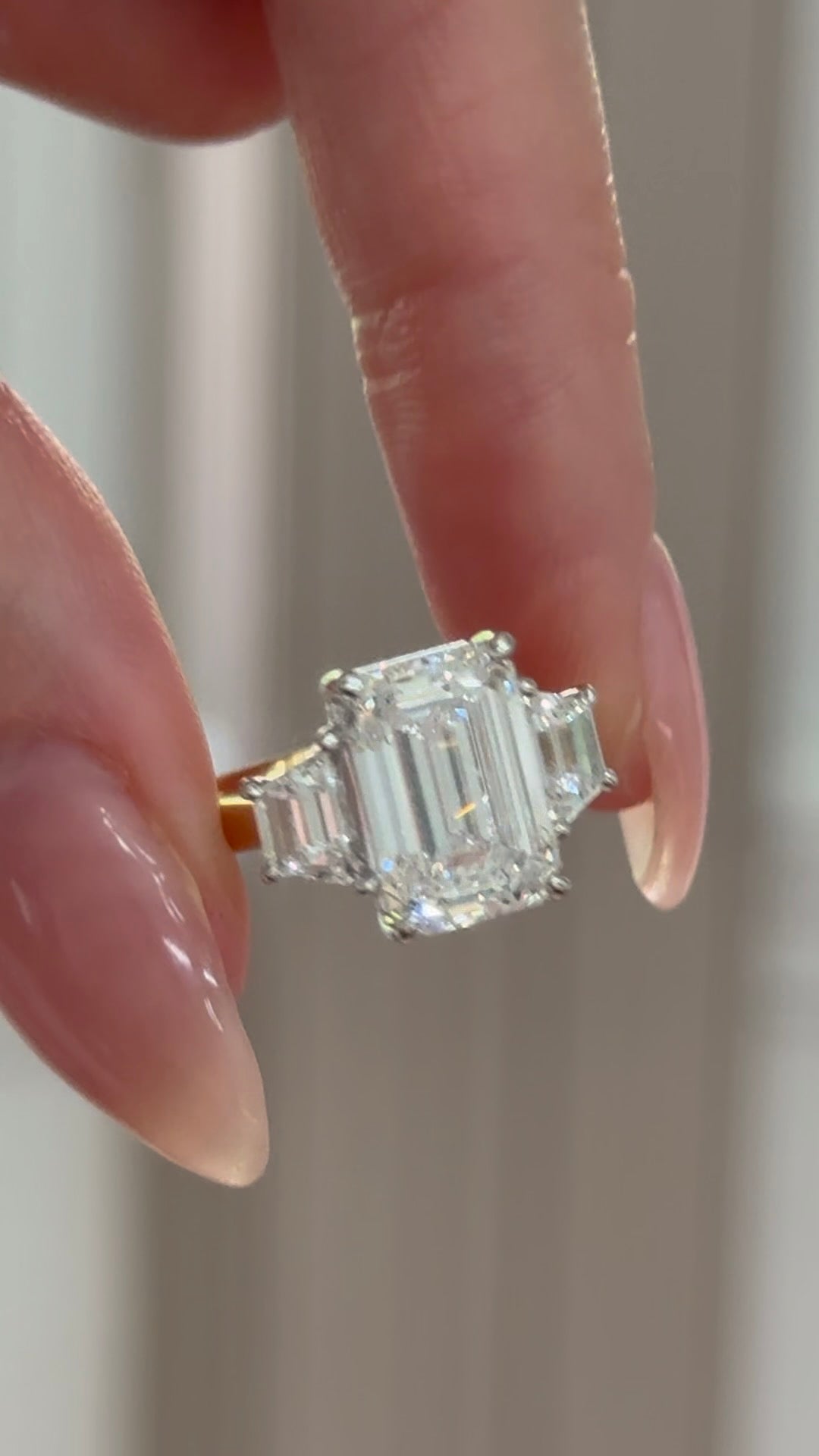 Emerald Cut Diamond with Trapezoid Sides in the Trilogy Design with Hidden Halo