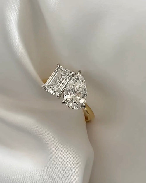 Emerald and Pear Cut Diamonds Toi et Moi Engagement Ring