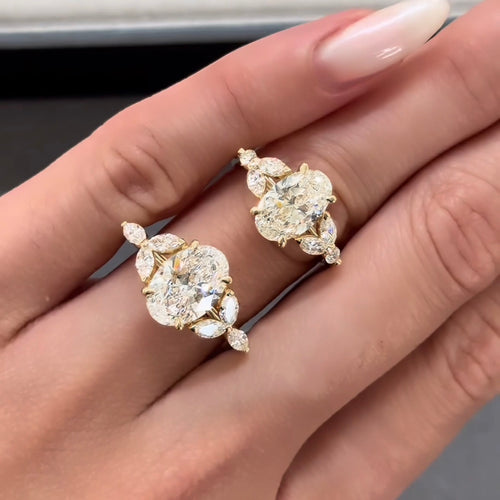 Oval Cut Diamond with Marquise Cut Diamond Sides Engagement Ring