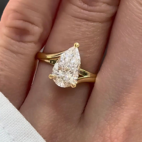 Pear Cut Diamond Swirl Cathedral Engagement Ring