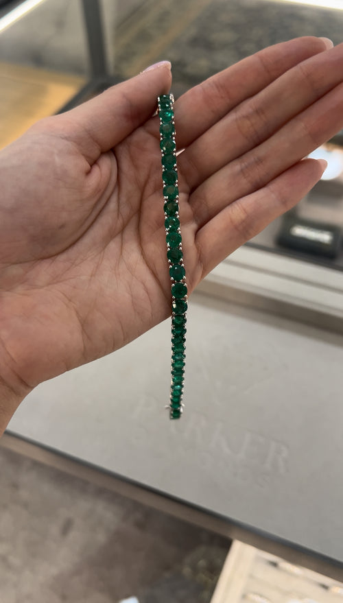 Round Brilliant Cut Green Emerald Tennis Bracelet in White Gold