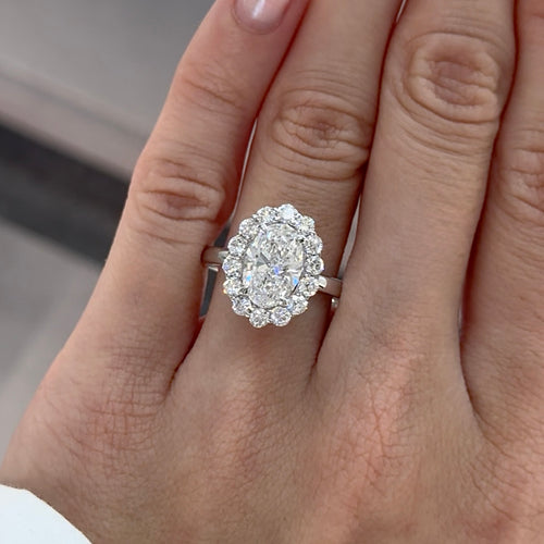 Oval Cut Diamond with Round Brilliant Cut Diamond Halo Engagement Ring