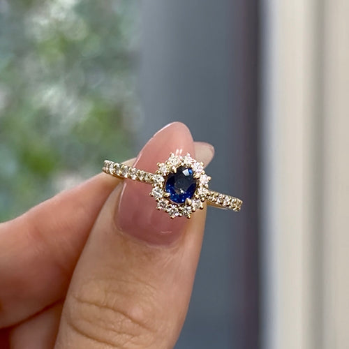 Oval Cut Sapphire with Round Brilliant Cut Diamond Halo Engagement Ring