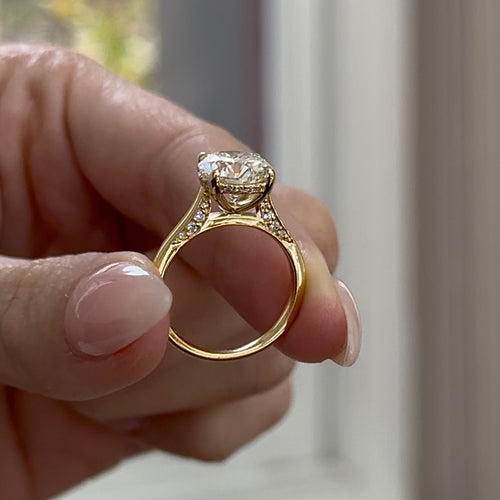 Round Brilliant Cut Diamond Cathedral Solitaire with Diamond Accents and Hidden Halo