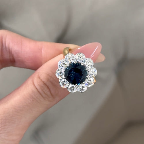 Sapphire Centre with Round Brilliant Cut Diamond Halo Engagement Ring