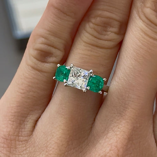 Princess Cut Diamond Centre with Round Brilliant Cut Green Emerald Sides Trilogy Engagement Ring