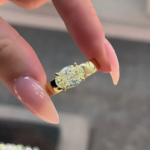 Oval Cut Fancy Yellow Diamond East-West Set Engagement Ring
