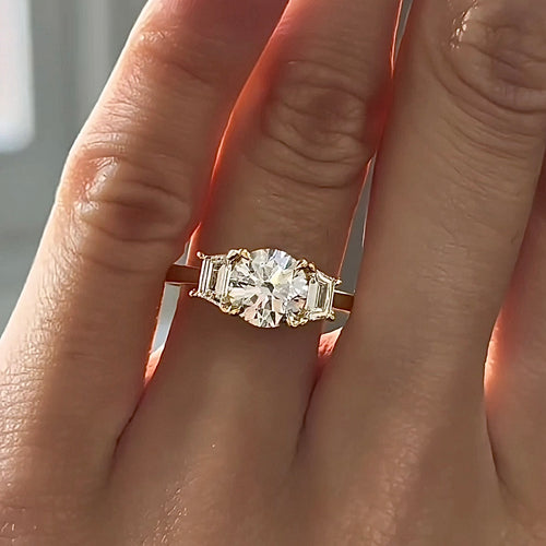 Round Brilliant Cut Diamond Centre with Trapezoid Sides Trilogy Engagement Ring