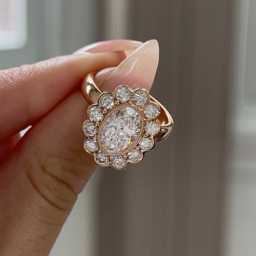 Oval Cut Diamond with Round Brilliant Cut Diamond Halo Engagement Ring in 18K Rose Gold