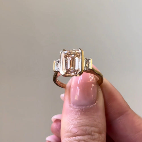 Emerald & Trapezoid Semi-Bezel Trilogy Engagement Ring